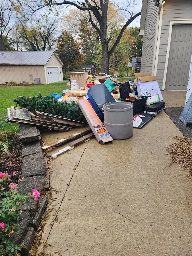 Dumpster being loaded with debris for 12 Yard Dumpster Rental in Upper Saucon